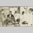 Naval officers and other men standing around a table (ddr-njpa-13-1258)