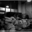 Two men with shipping bundles (ddr-densho-426-948)