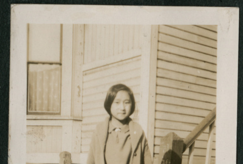 Girl  poses on boardwalk (ddr-densho-359-624)
