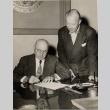 Ingram M. Stainback signing a document (ddr-njpa-2-703)