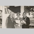 Ingram Stainback posing with female Red Cross worker and priest (ddr-njpa-2-1189)