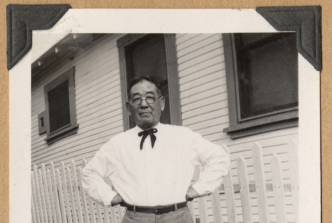 Man wearing a slim bowtie (ddr-densho-542-214)