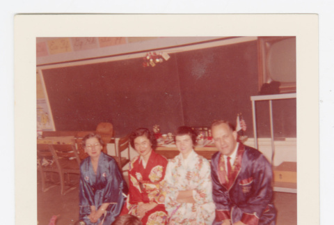 Four adults kneeling on floor (ddr-densho-562-72)