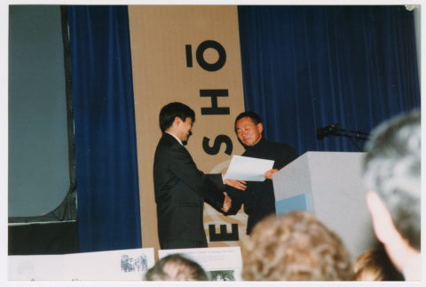 Scott Oki and Tom Ikeda shaking hands (ddr-densho-506-51)