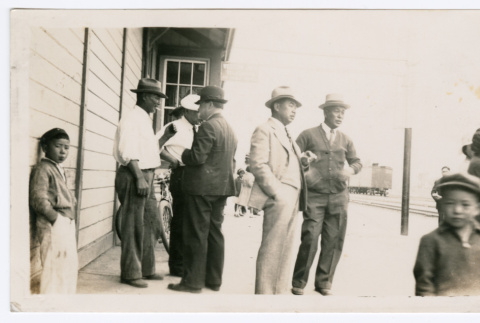 Group of men outside building (ddr-densho-480-84)