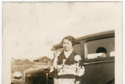 Gloria Kusano Kubota standing by car (ddr-densho-122-631)
