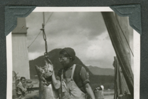 Benjamin holding large fish (ddr-densho-540-91)
