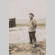 Man stands sideways (ddr-janm-17-37)