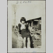 Girl sitting on a stump (ddr-densho-321-1151)
