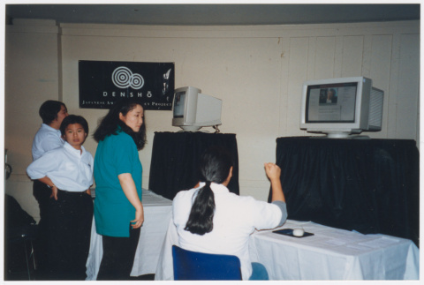 Staff working at Densho computer displays (ddr-densho-506-121)