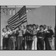 Schoolchildren with American flag (ddr-densho-151-53)