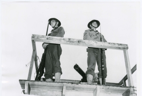 Two soldiers on a wooden platform (ddr-densho-1007-282)