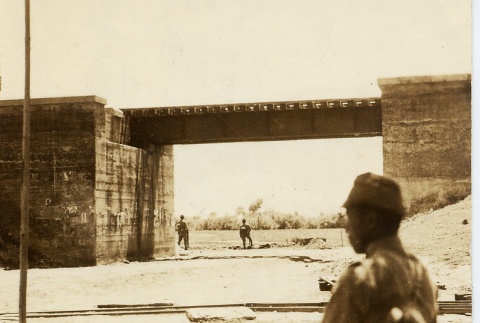 Soldiers standing near a bridge (ddr-njpa-6-123)