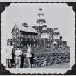 Three children in front of a model stone castle (ddr-densho-300-594)