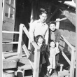 Japanese Americans in front of barracks apartment (ddr-densho-15-48)