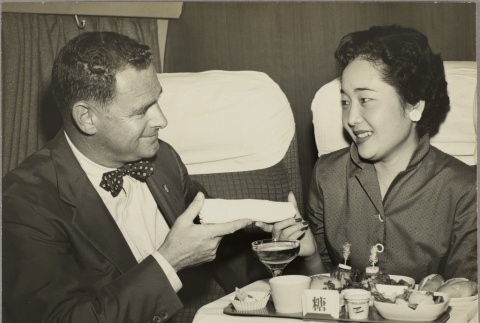 Ruth Befu serving a meal on an airplane (ddr-njpa-5-365)