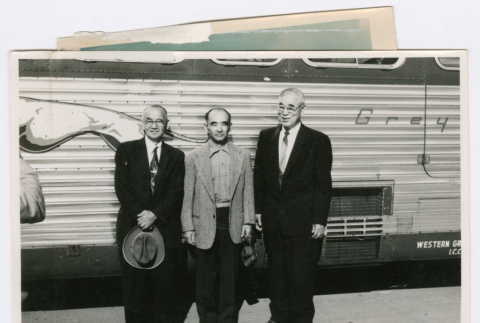 Three men in front of Greyhound bus (ddr-densho-501-26)