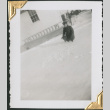 Man crouching in snow (ddr-densho-434-295)