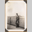 Man poses on a bridge (ddr-densho-542-135)