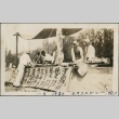 Men working at a table during a field day (ddr-densho-321-628)