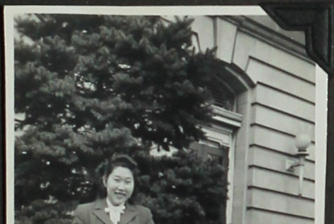 Young woman in front of building (ddr-densho-201-354)