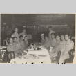 Eleven men and two women around table at Leon & Eddie's nightclub (ddr-densho-466-420)