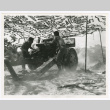 Cpl. Edward Nakamura and Pfc. George Tanna firing 105mm Howitzer in the Battle for Leghorn (ddr-densho-1007-163)