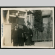 Men pose in front of house (ddr-densho-359-840)