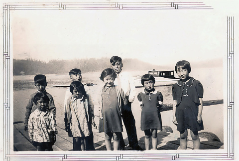 Eight children standing on dock (ddr-densho-474-163)