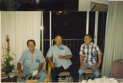 Three men sitting by balcony (ddr-densho-466-503)