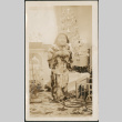Girl by Christmas tree (ddr-densho-316-248)