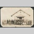 Group photo of men outside a building (ddr-densho-483-257)