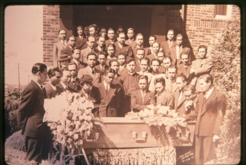 Men standing behind coffin on steps of building (ddr-densho-330-21)