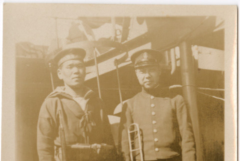 Two men in uniform on board ship (ddr-densho-426-2035)