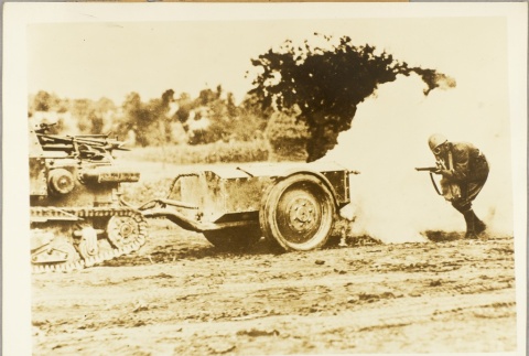 Soldier taking cover near a tank (ddr-njpa-13-820)