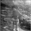 Young girl standing on rocks, likely Kris Domoto (ddr-densho-329-700)