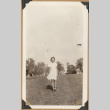 Girl on a grassy lawn (ddr-densho-542-179)