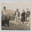Four people in front of barn (ddr-janm-17-23)