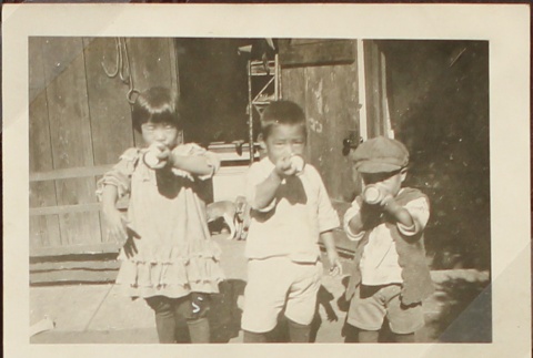 Nisei children drinking milk (ddr-densho-259-426)