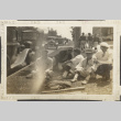 Five men sitting on side of street (ddr-densho-326-385)