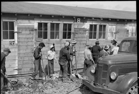 Japanese American workers digging a ditch (ddr-densho-151-342)