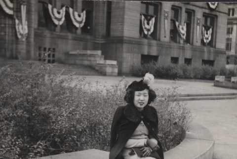 Japanese American woman with suitcase (ddr-csujad-55-2296)