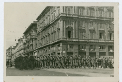 Soldiers marching in city street (ddr-densho-368-99)