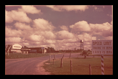 Buildings and sign near the entrance to Crystal City Department of Justice Internment Camp (ddr-csujad-55-1508)