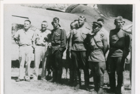 Servicepeople standing front of plane (ddr-densho-1007-177)