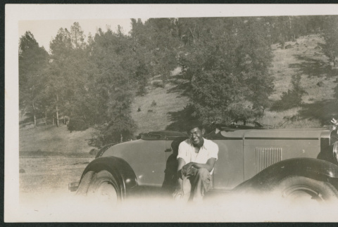 man on car (ddr-densho-378-890)