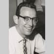 Man smiling for a photograph (ddr-njpa-2-277)