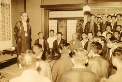Suiun Komuro speaking to a group of men (ddr-njpa-4-498)