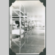Row of bunk beds in barracks (ddr-ajah-2-383)