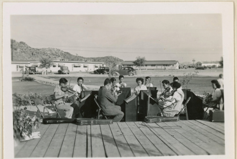 Orchestra performing at an event (ddr-densho-37-991)